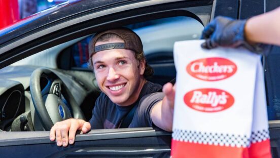 Checkers customer receiving a meal through the drive-thru.