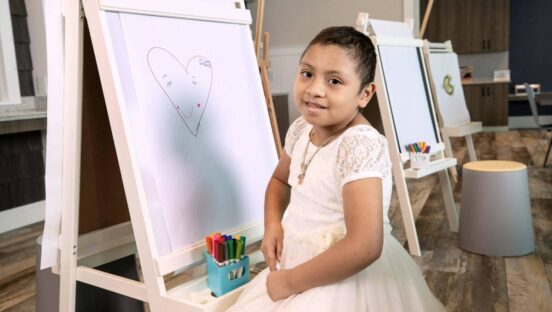 A St. Jude patient poses for a picture.