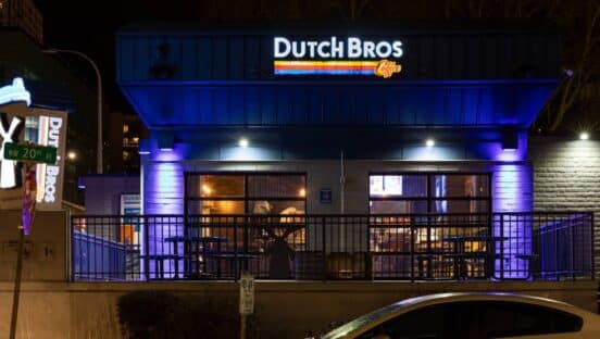 Dutch Bros restaurant from the outside at night.