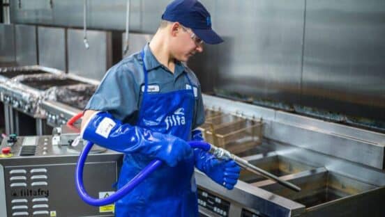 Someone cleaning in a kitchen.