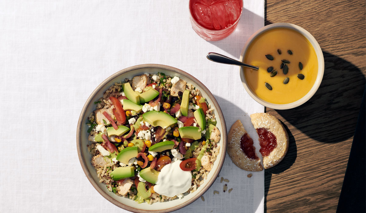 Panera Bread's Baja Grain Bowl On A Table Next To Soup