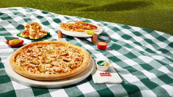 The Cheesy Burger Pizza features Papa Johns’ fresh, never frozen dough topped with a signature burger sauce, generous portions of beef, tomato, dill pickle, and real cheese made from mozzarella, served of course with a cup of the brand’s famous Special Garlic Sauce and pepperoncini.