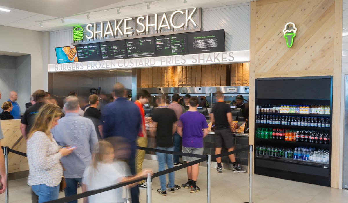 Customers Line Up At A Shake Shack Airport Location