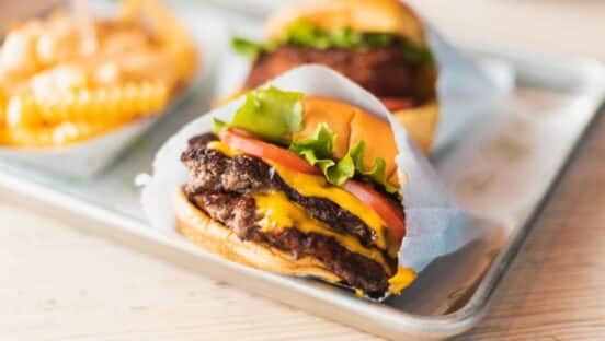 Shake Shack burger and fries on plate.