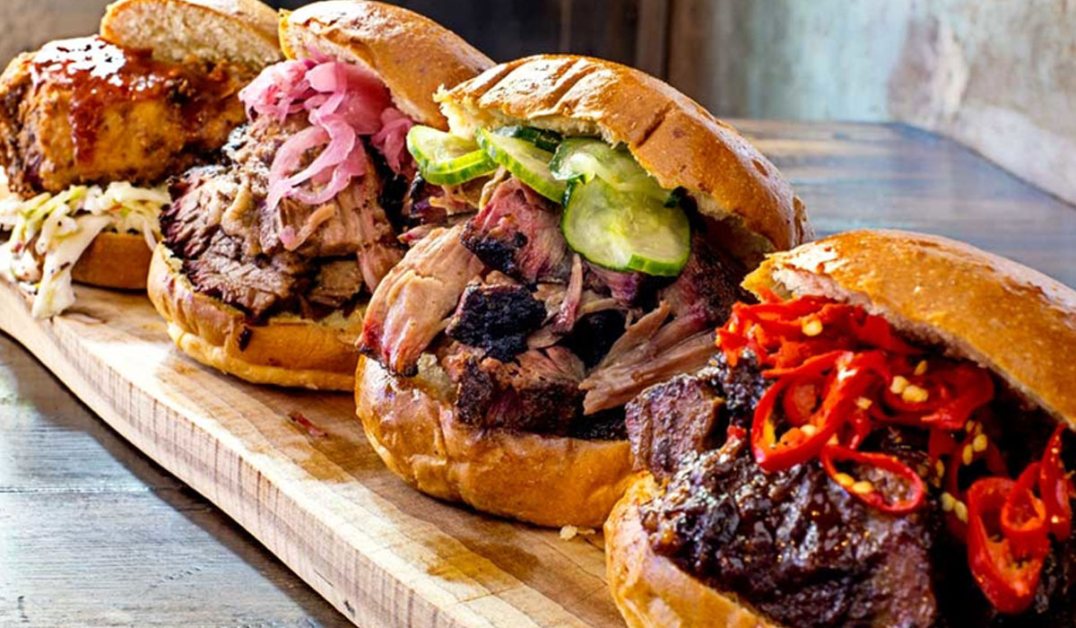 A Row Of Pork Sandwiches At Mighty Quinn's Barbeque Restaurant